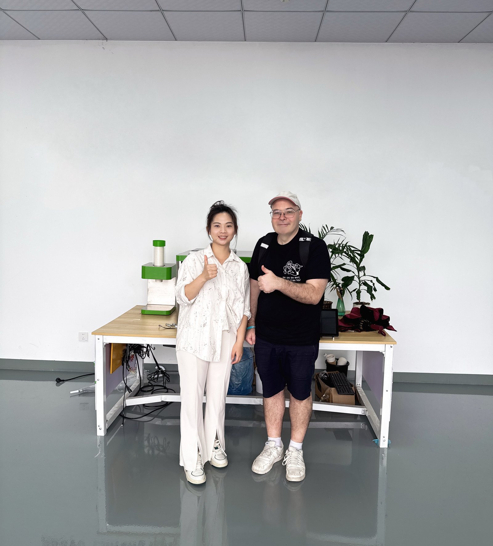 LINFENG team member and a visiting customer posing together