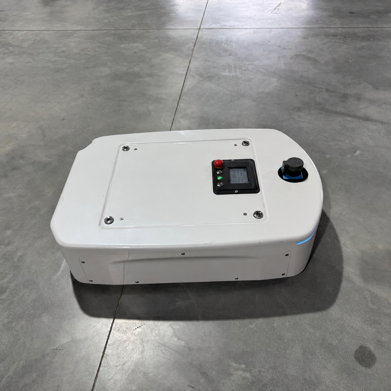 Side view of the AGV chassis showing its control panel, laser scanner and blue status light