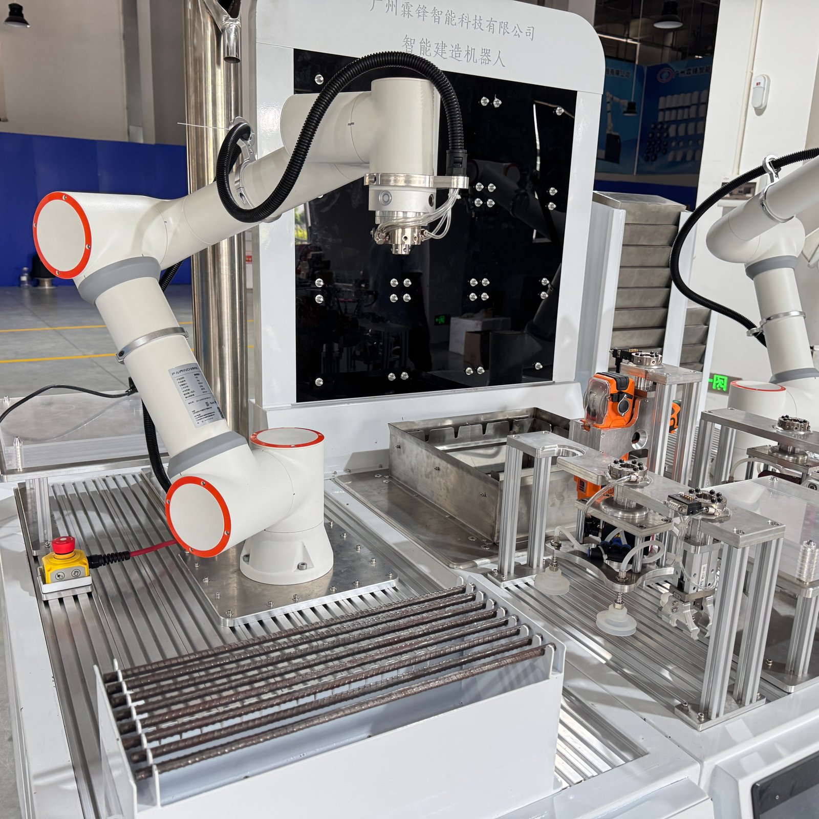 Collaborative robot arm beside a rebar training fixture