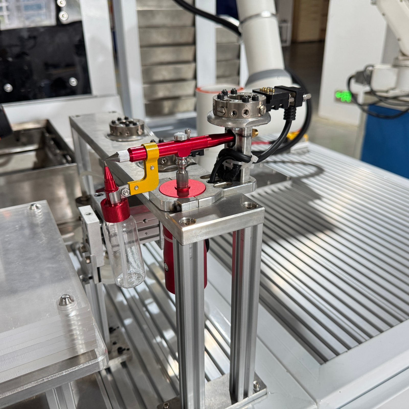 Close-up of the spraying tool and its mounting fixture